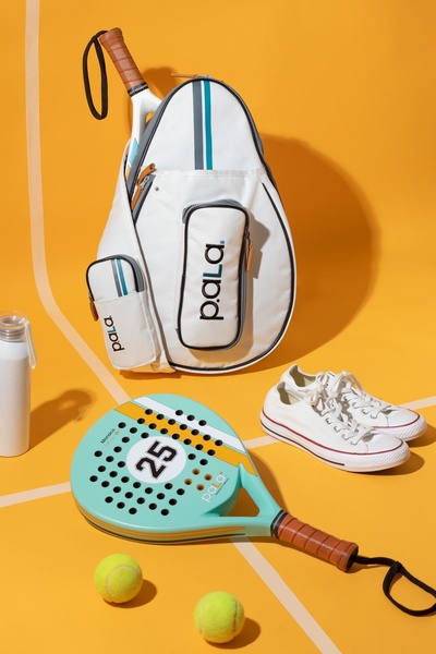 padel racket, padel bag, tennis sneakers, sports water bottle, tennis balls, new arrival, bestseller push, minimalist, flat lay, energetic, fresh, yellow, neutral